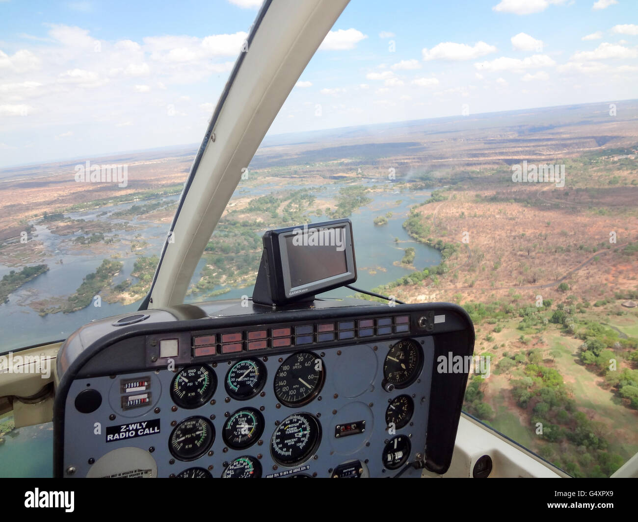 Zimbabwe, Matabeleland North, Hwange, Victoria Falls, helicopter tour, cockpit of the helicopter with landscape Stock Photo