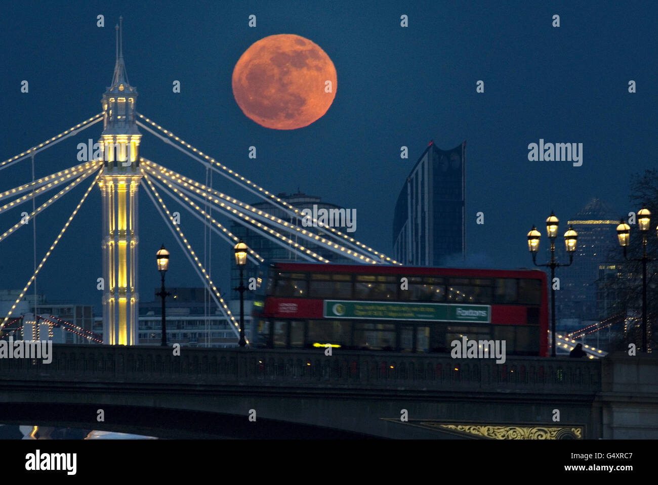 The full moon appears red as it rises behind the recently refurbished ...