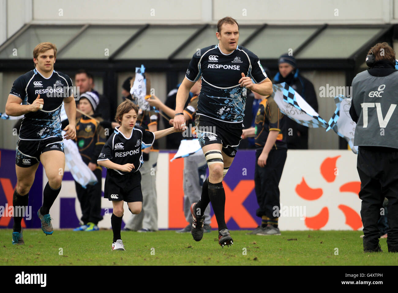 Glasgow warriors alastair kellock centre leads out the team hi-res stock photography and images