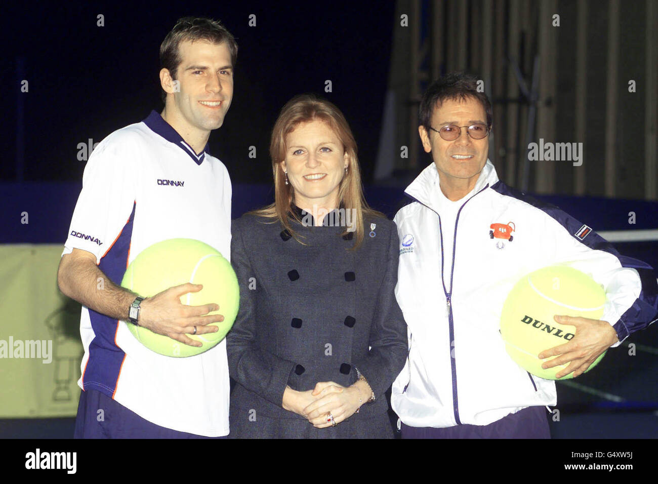 The Duchess of York, Sarah Ferguson, with British tennis player Greg Rusedski (left) and singer Sir Cliff Richard at The London Arena in Docklands for the York tennis challenge cup for the charity Children in Crisis. Stock Photo