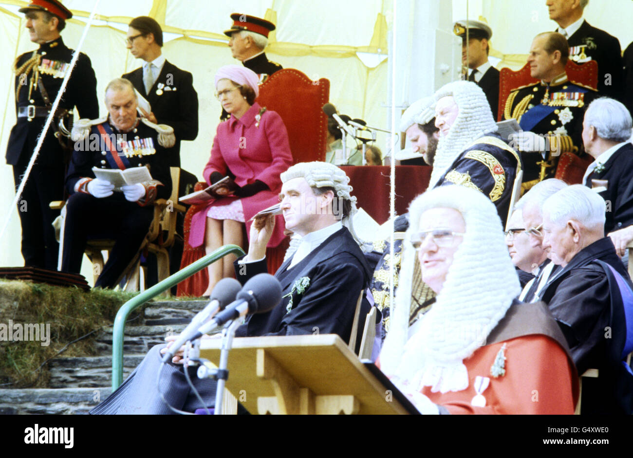 Queen Elizabeth II seated alongside Lt Governor Sir John Paul (left) when, in her capacity as Lord of Man, she attended the annual open air sitting of the Tynwald, the legislature of the Isle of Man. The ceremony was a climax to the Tynwald's millennium celebrations. It is claimed to be the oldest continuous parliamentary body in the world. Stock Photo