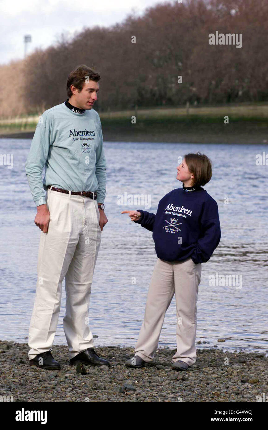 Cambridge rower Joshua West (6ft 9.5in) and Oxford rowing cox Kajsa McLaren  (4ft 10.5in) on the Thames beach at Putney Bridge on the day the crews were  announced for the 2000 Boat