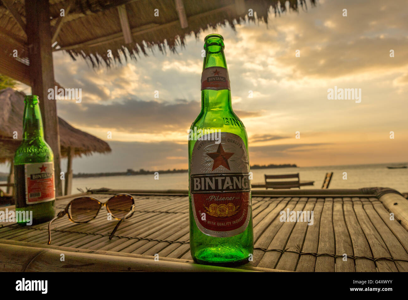 Indonesia, Nusa Tenggara Barat, Lombok Utara, Beer at sunset on Pulau Island Gili Meno Stock Photo