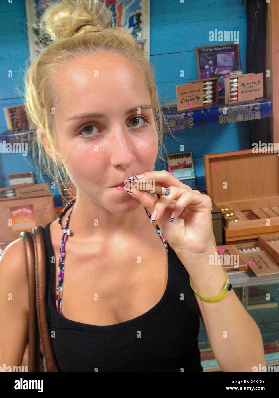 Dominican Republic, La Altagracia, Los Melones, For the first time try a  cigar Stock Photo