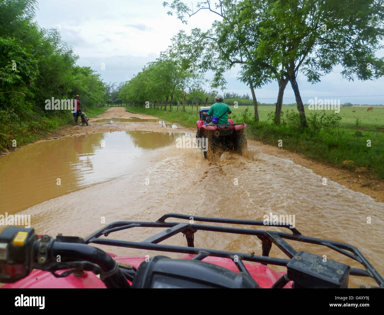 Dominican Republic, La Altagracia, Los Melones, With the quad through the largest puddles Stock Photo