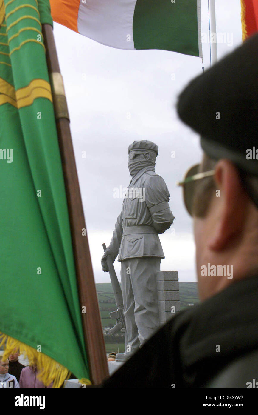 A member of an INLA (Irish National Liberation Army ) colour party looks on during the official unveiling of a statue at the INLA burial plot in Londonderry city cemetery. The controversal statue depicts a masked INLA member with a rifle. * It has caused outrage amongst protestants in the city. Stock Photo
