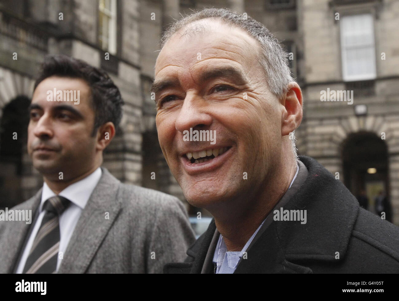 Former MSP Tommy Sheridan (right) and lawyer Aamer Anwar arrive at the Court of Session in Edinburgh, Scotland, in the latest round of a long-running legal battle over his award for damages from the News of the World. Stock Photo