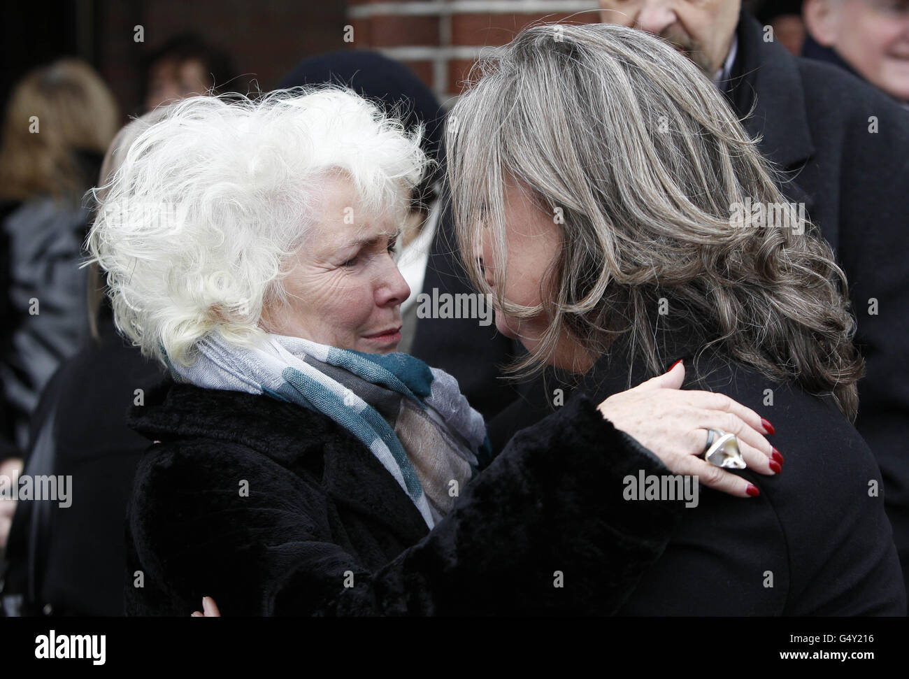 David Kelly's daughter Miriam is comforted by actress Fionnula Flanagan
