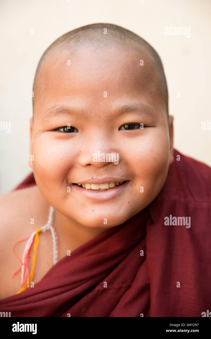 Portrait of a smiling novice monk, Nandamannya Temple, Old Bagan Archaeological Zone, Myanmar Stock Photo