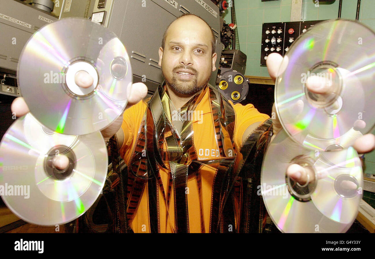 London's Odeon Leicester Square projectionist David de Souza, with discs of Disney/Pixar's new film Toy Story 2, which will be premiered in digital format, featuring Digital Light Processing (DLP) Cinema projection technology. * The film is the first major Hollywood film to be released in both a digital and tradional format. Stock Photo