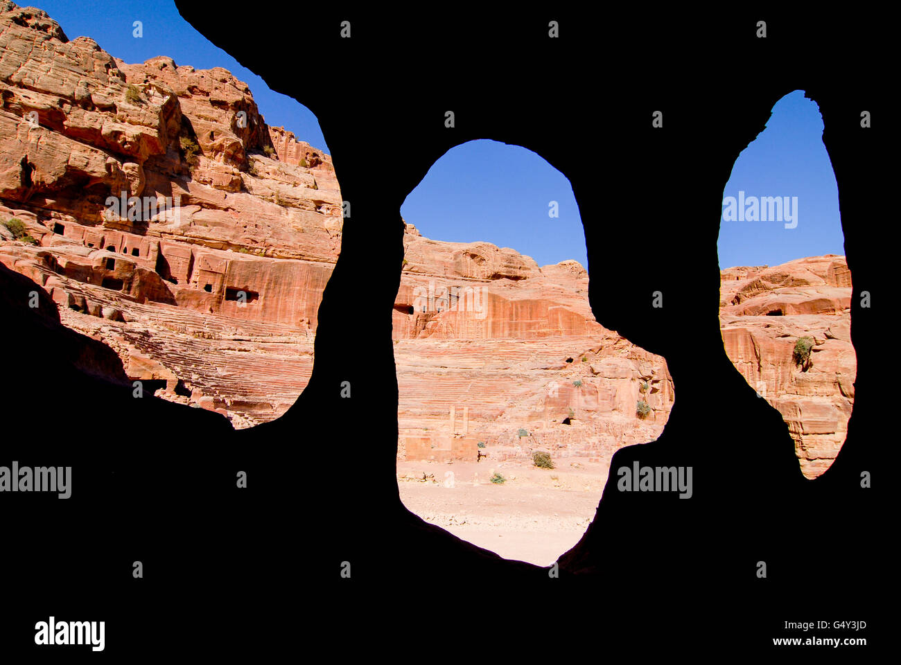 JORDAN, UNESCO world heritage archaeological site Petra, originally known as Raqmu to the Nabataeans, cave in sand stone / JORDANIEN, historische Nabataeer Stadt Petra, Hoehle im Sandstein, background backgrounds Stock Photo