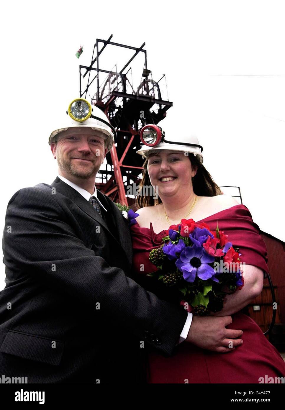 Christina Golledge, 35, and Mark Lee, 39, from Milton Keynes, who are due to be married at the Big Pit Mining Museum, in Blaenavon, South Wales. The couple decided to choose something different by tying the knot 300ft underground in a former coal mine. * For the unusual occasion, Miss Golledge's burgundy dress and Mr Lee's suit are topped by hard hats and lights with gas masks in case of emergencies. Stock Photo