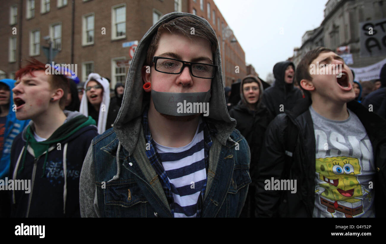 Internet users hold a protest march in Dublin against SOPA (Stop Online Piracy Act) and ACTA (Anti-Counterfeiting Trade Agreement) legislation being implemented by the Irish Government and EU. Stock Photo
