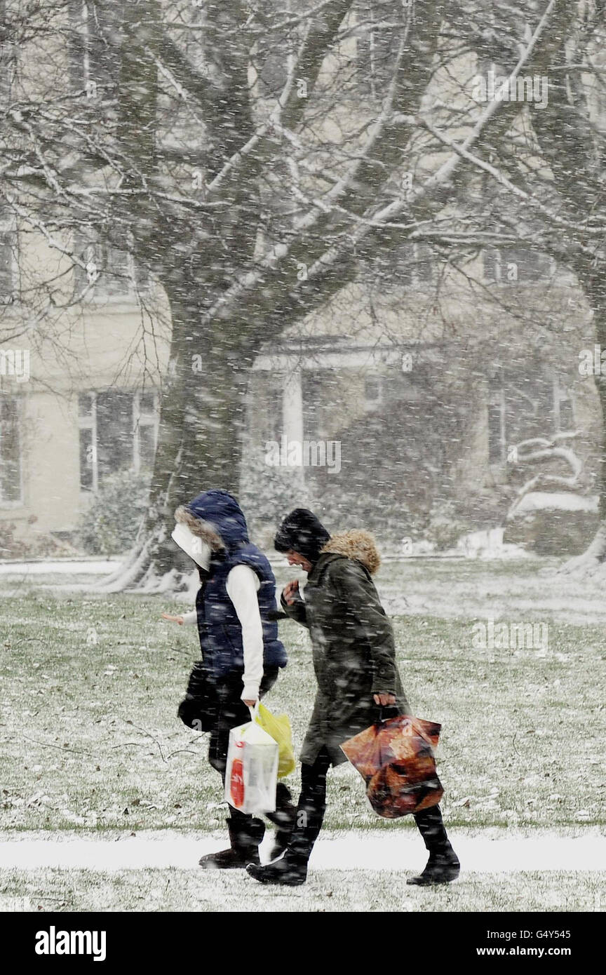 Shoppers make their way through falling snow in Harrogate as
