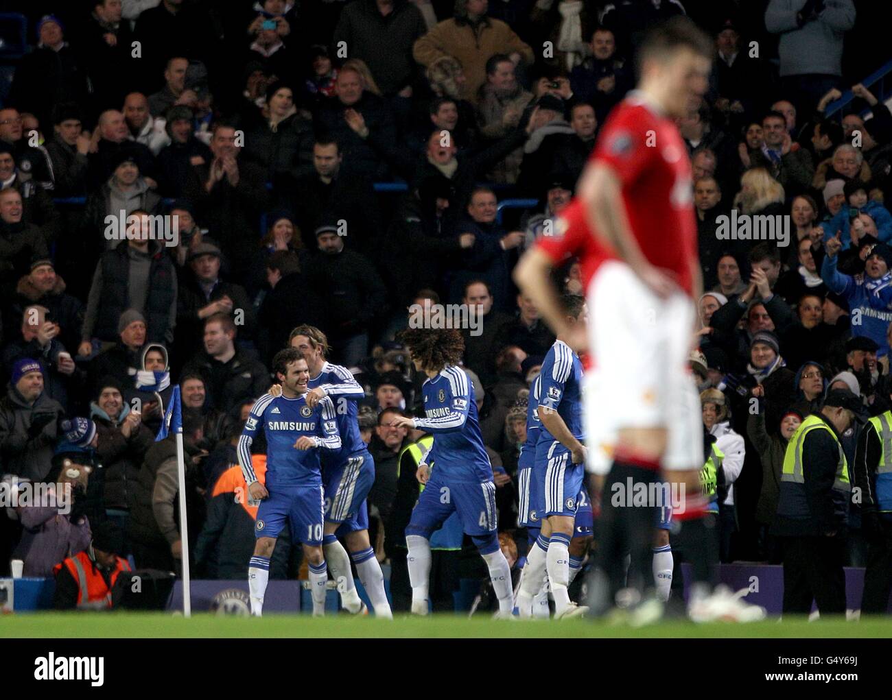 Chelsea's Juan Mata (left) celebrates with his team-mates after scoring his side's second goal of the game Stock Photo
