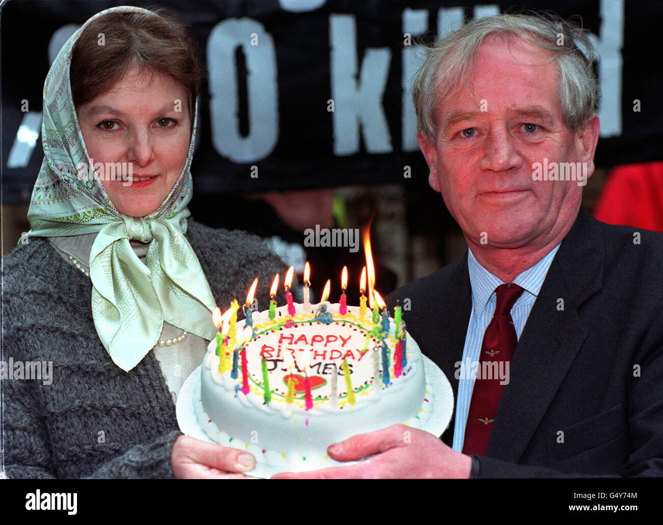 David and Diana Mawdsley present a birthday cake on the 27th birthday