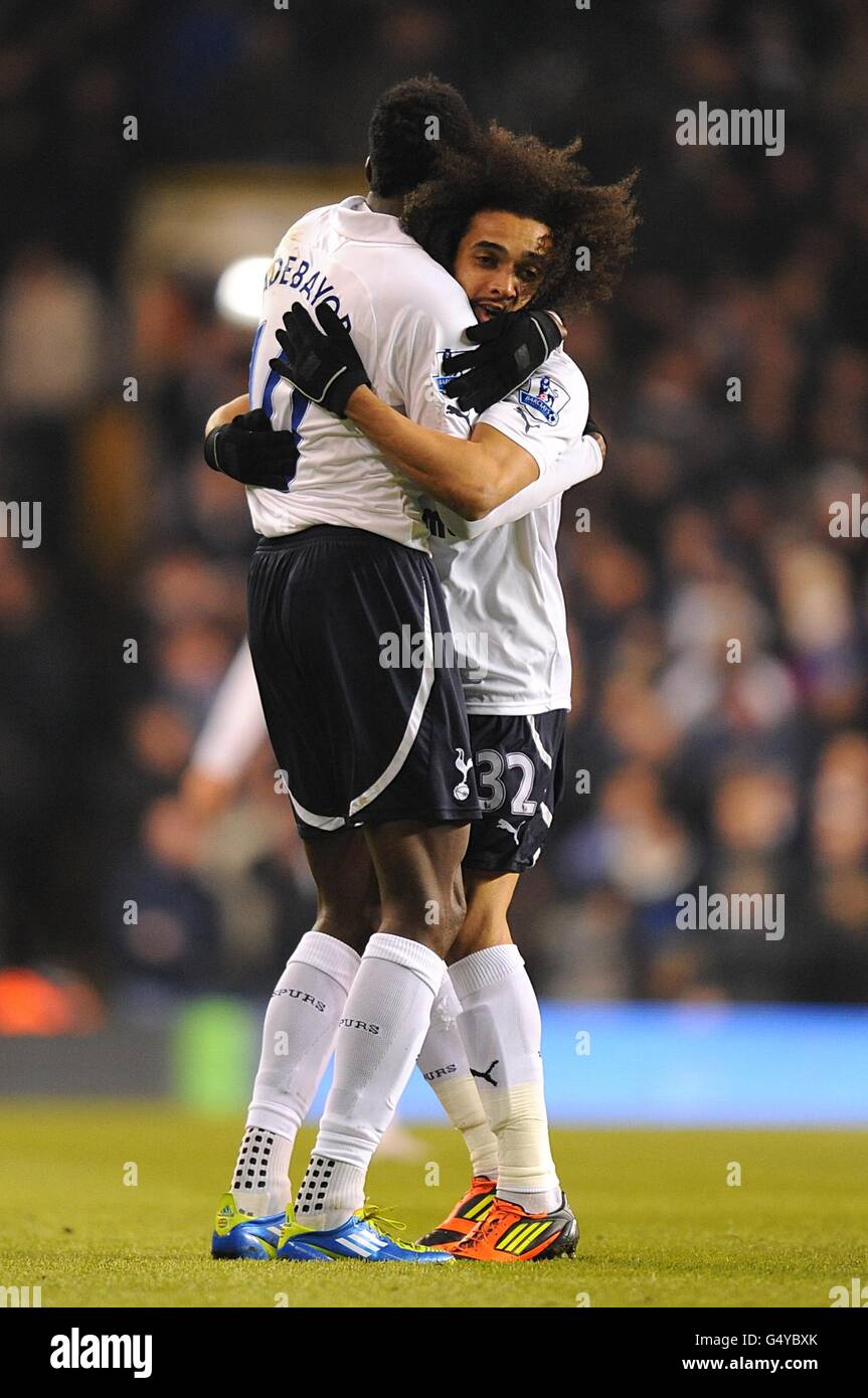 Tottenham Hotspur's Benoit Assou-Ekotto (right) celebrates scoring their first goal of the game with team-mate Emmanuel Adebayor who provided the assist Stock Photo