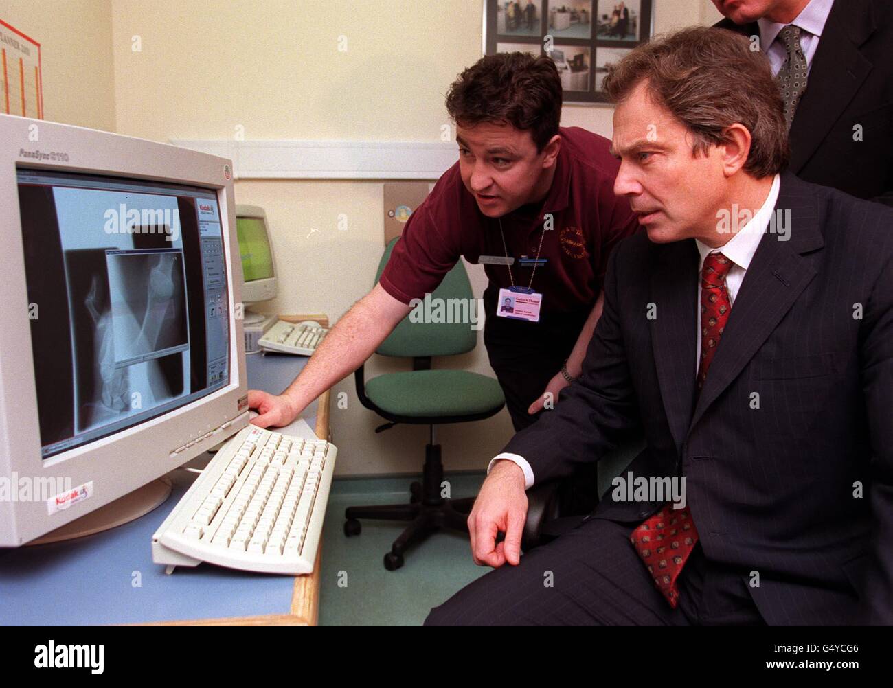 Prime Minister Tony Blair is shown new computer software as he opens a 1 million upgraded Accident & Emergency unit at London's St Thomas's Hospital. During the visit Mr Blair promised a revolution in casualty care, with a new 5-point plan. designed to end the 'lottery of care which meant patients' treatment depended on how efficient their local hospital was'. Stock Photo