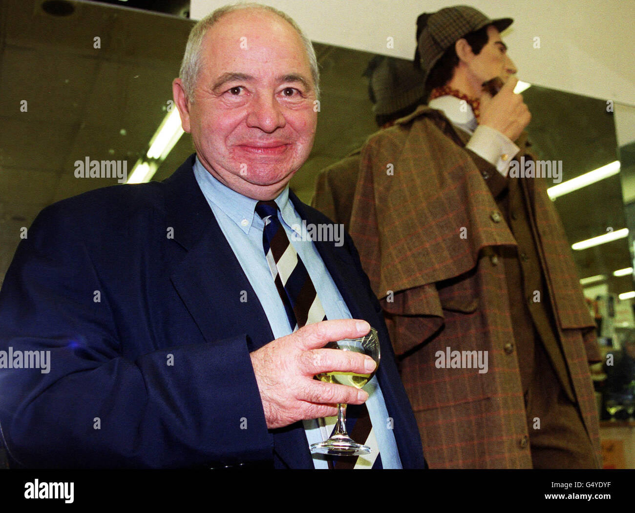 Detective writer Colin Dexter stands in front of fictional detective Sherlock Holmes at the Sherlock Awards at Murder One on Charing Cross Road, London. Mr Dexter won the Best Detective Created by a British Author Award for his character Inspector Morse. *-Inspector Morse made his debut a quarter of a century ago in the book 'Last Bus to Woodstock'. Stock Photo