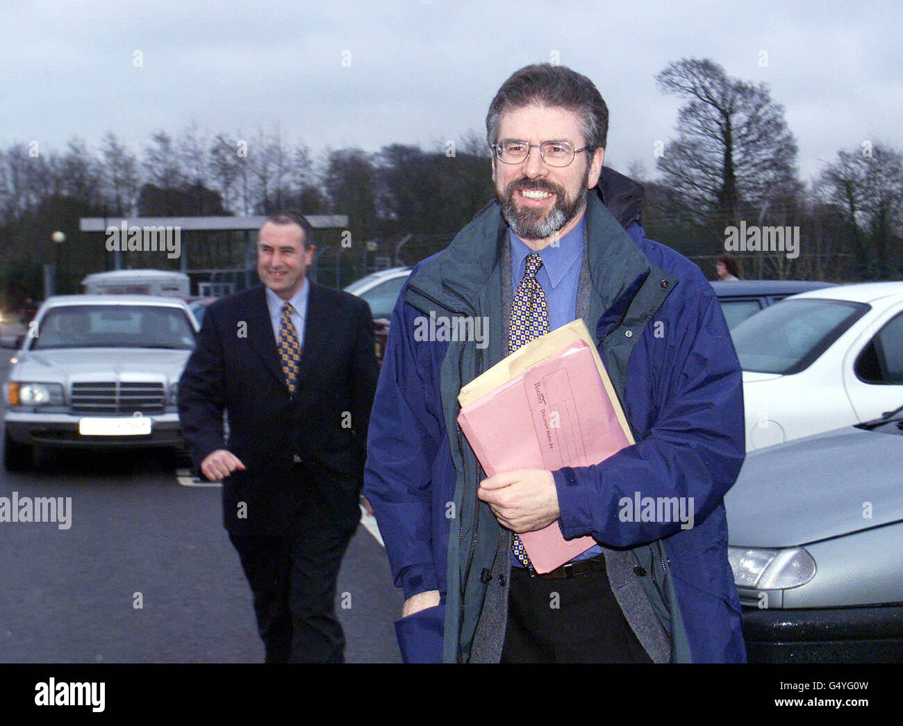 Sinn Fein President Gerry Adams with Mitchell McLaughlin, arriving at Castle Buildings, Stormont in Belfast for talks with the British and Irish Goverments to help revive the Good Friday Agreement. Stock Photo