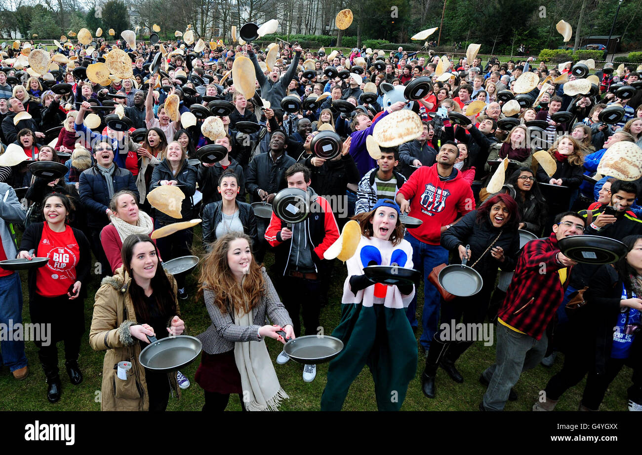 Staff and students at the University of Sheffield take part in The Big Flip and break the Guinness World Record for the most people flipping pancakes at The Endcliffe Village, Sheffield. Stock Photo
