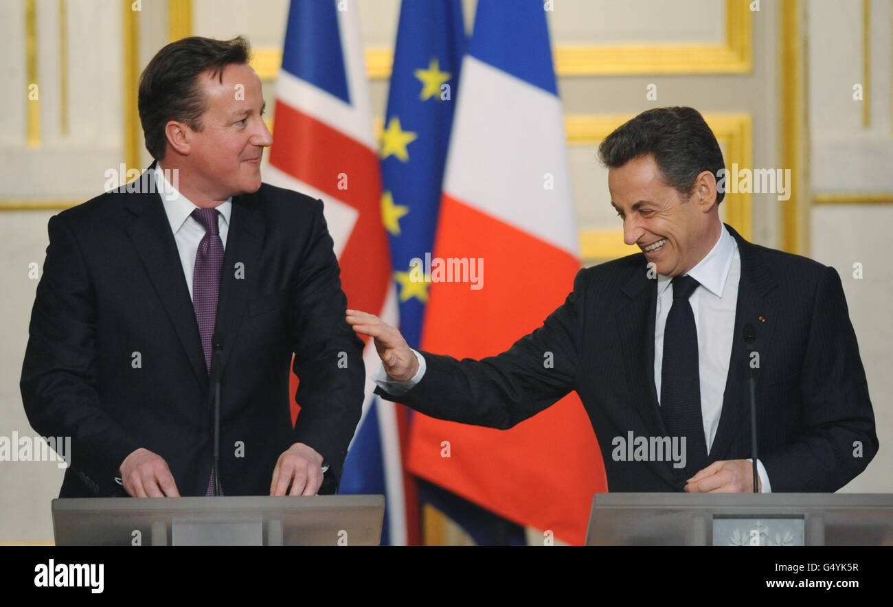 Prime Minister David Cameron and French President Nicolas Sarkozy during their joint news conference at the Elysee Palace in Paris today. Stock Photo