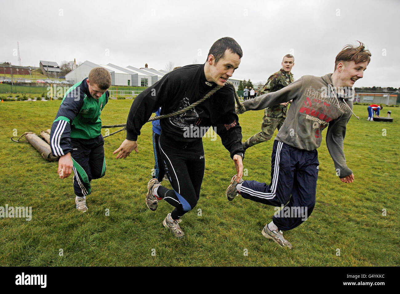 Ireland's Darren O'Neill (centre), Ciaran Forde (left) and Michael O'Reilly drag logs during the Irish Defence Forces endurance and team building assault course at the Curragh Army Camp, Curragh. Stock Photo