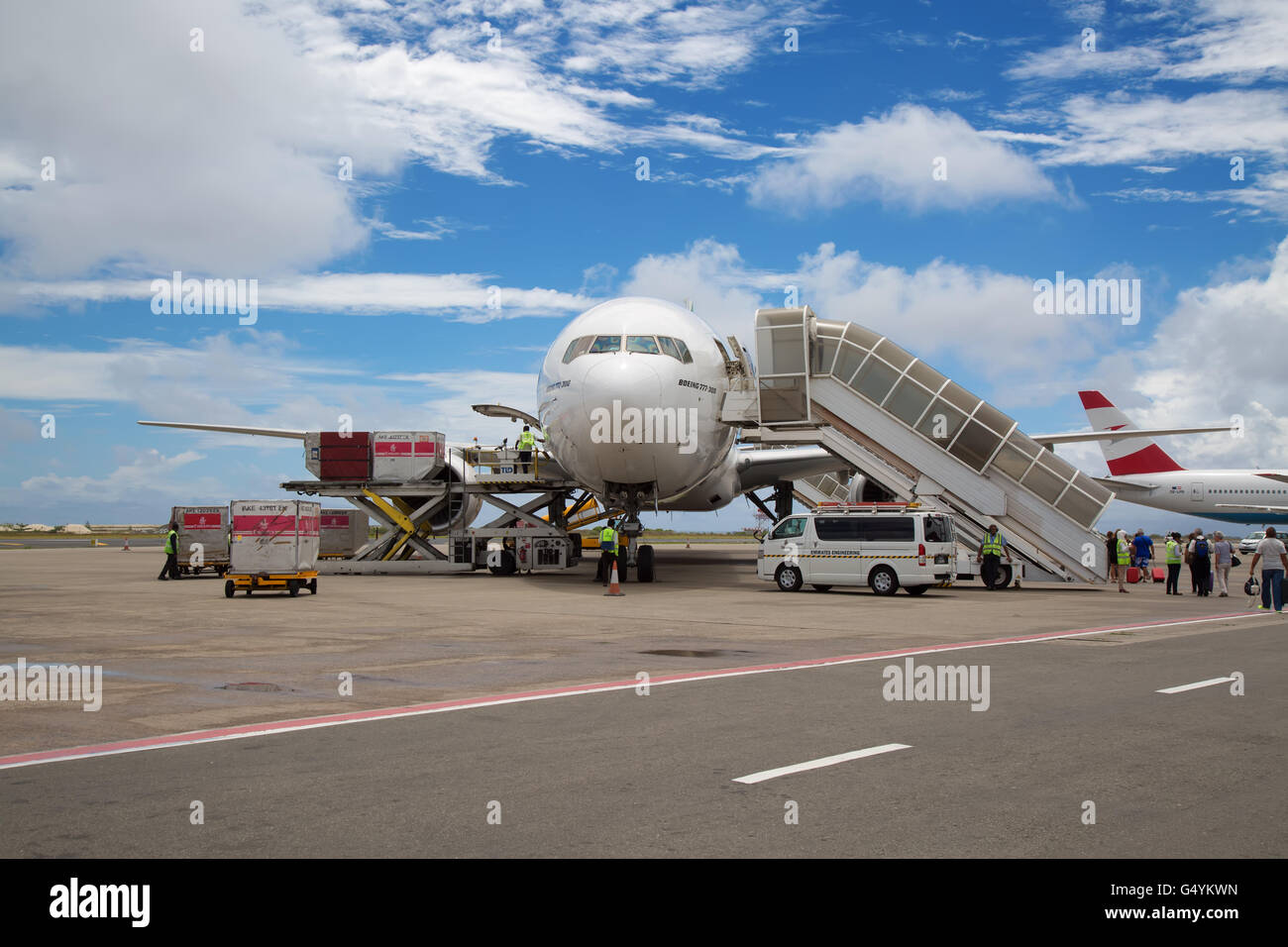 MALE - FEBRUARY 20: Emirates B-777 preparing for departure on February 20, 2016 in Male, Maldives. Busy Male airport is the prim Stock Photo
