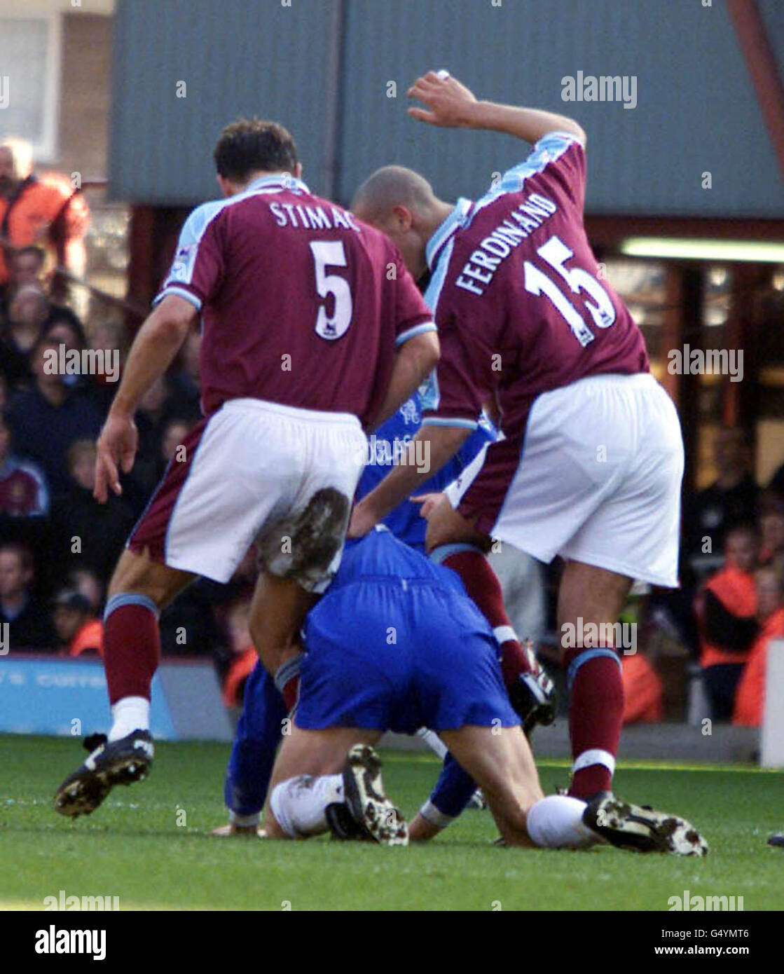 Tore Andre Flo, centre, Igor Stimac, left, and Rio Ferdinand, right, during the West Ham v Chelsea Premiership football match at Upton Park. * Flo and Stimac were booked after this scuffle during the first half. Stock Photo