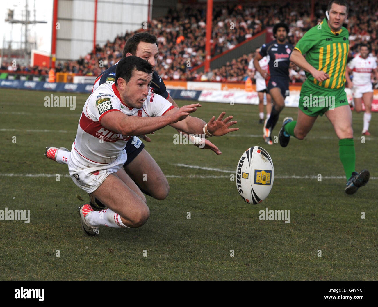 Hull Kingston Rovers' Shannon McDonnell (left) beats St Helens' James ...