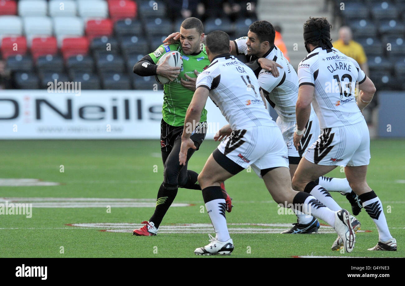 Salford's Danny Williams is tackled by Widnes' Frank Winterstein, Willia Isa and Jon Clarke during the Stobart Super League match at the Stobart Stadium Halton, Widnes. Stock Photo