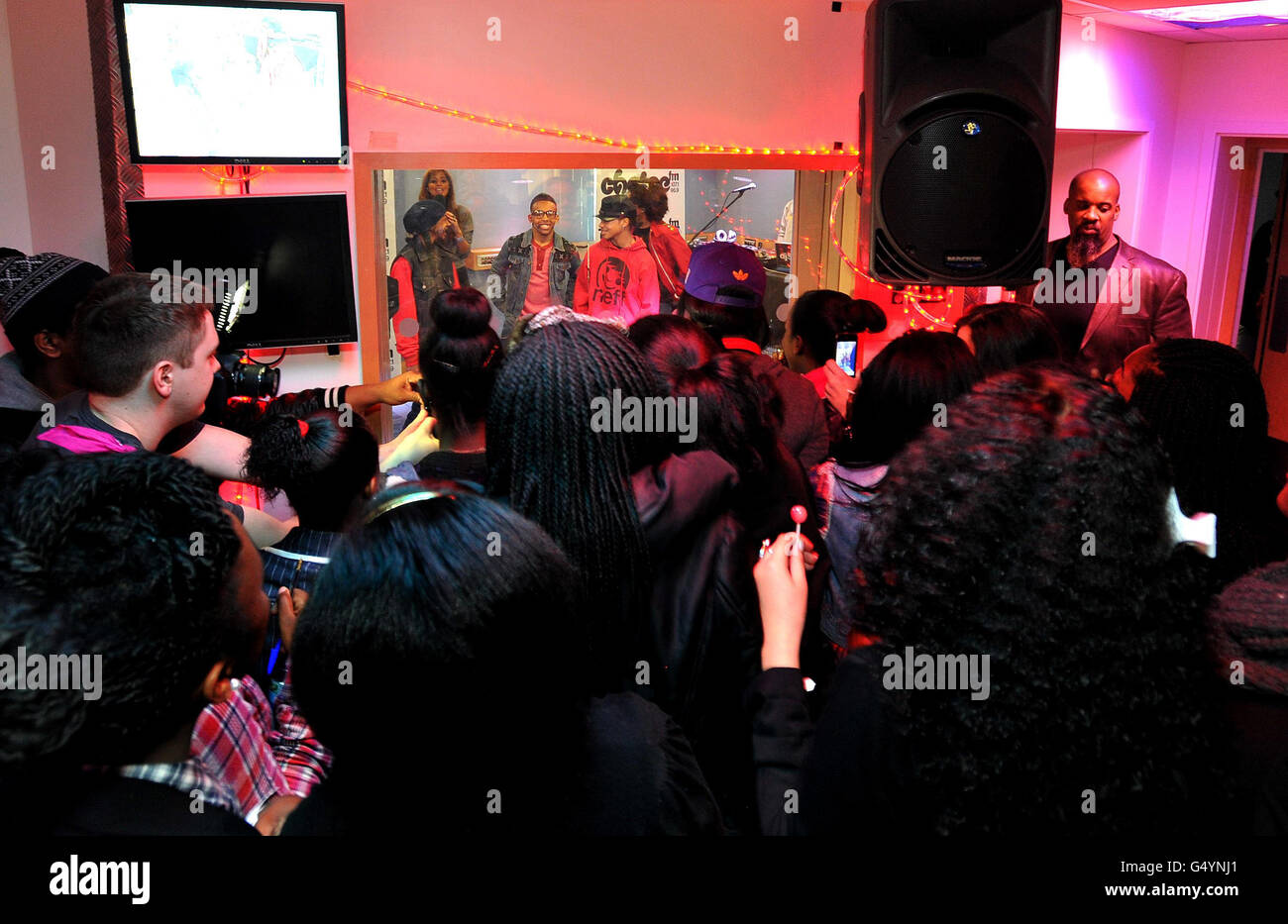 Fans of the new American pop band Mindless Behavior, watch during a live performance in the ChoiceFM studio Leicester Square in central London. Stock Photo