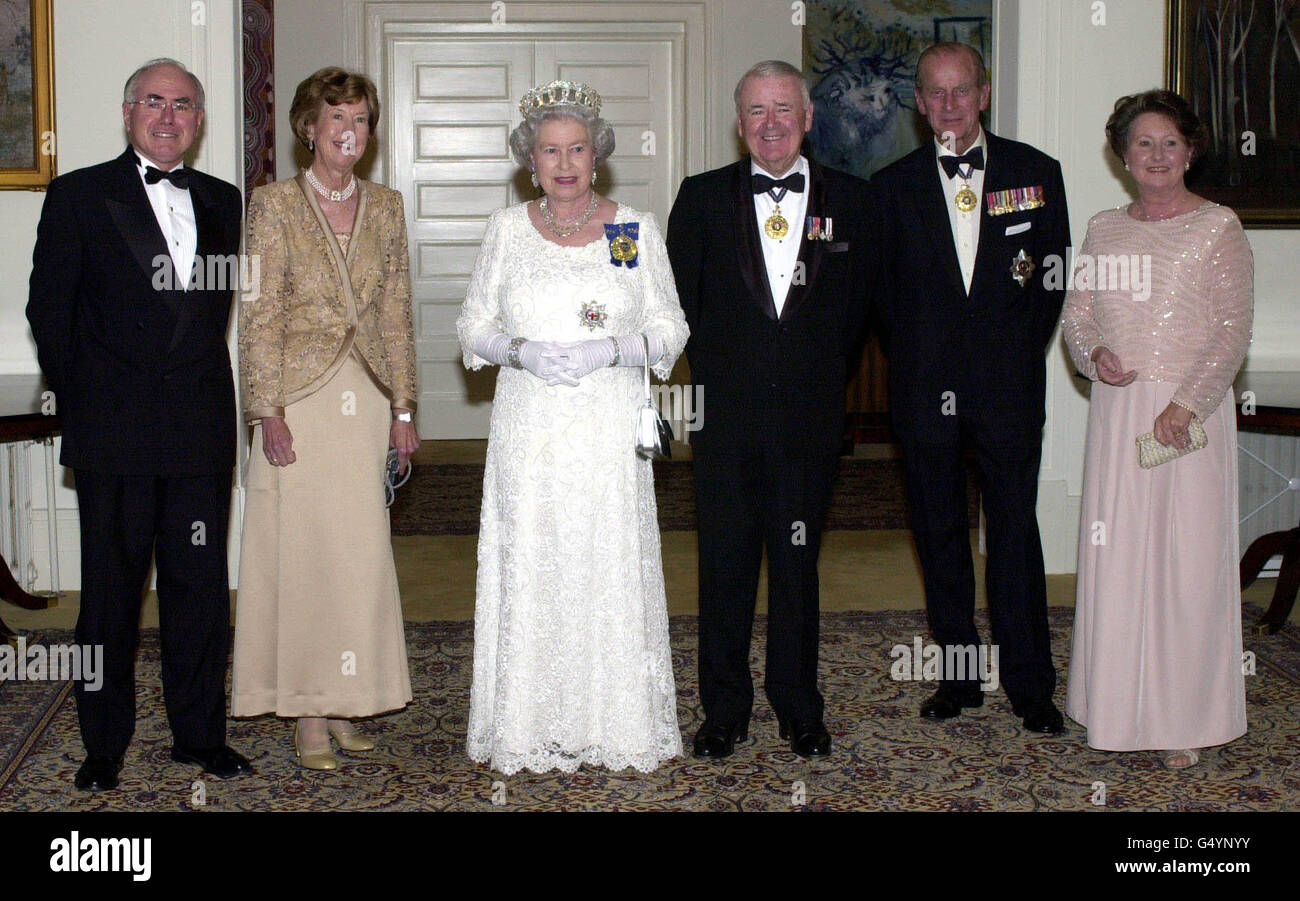 The Queen, accompanied by the Duke of Edinburgh (2nd Right), stands with, from left, Australian Prime Minister John Howard, Lady Deane, wife of Sir William Deane the Governor General of Australia (3rd Right) and the Prime Minister's wife Jeanette Howard. * before a State Banquet at the Government house, Canberra. Stock Photo