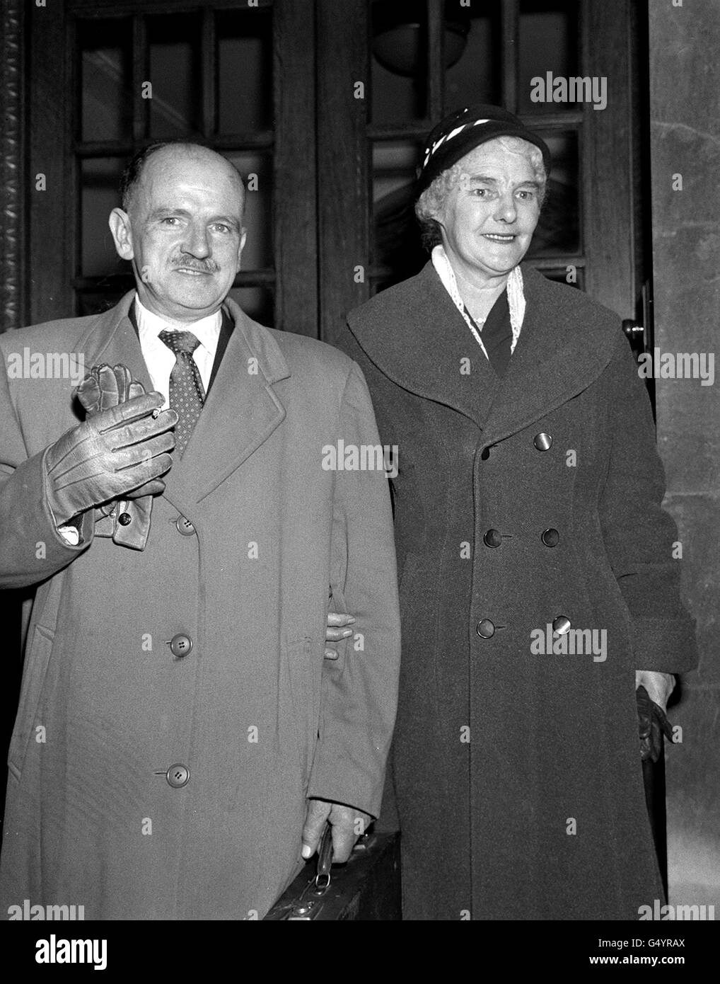 Alexander Gordon Bonnyman, jailed for a year for the manslaughter of his first wife bu neglect in 1942, with his second wife in London, after attending a public sitting of the General Medical Council Disciplinary Committee, at which his name was restored. *after a period of 18 years. Stock Photo