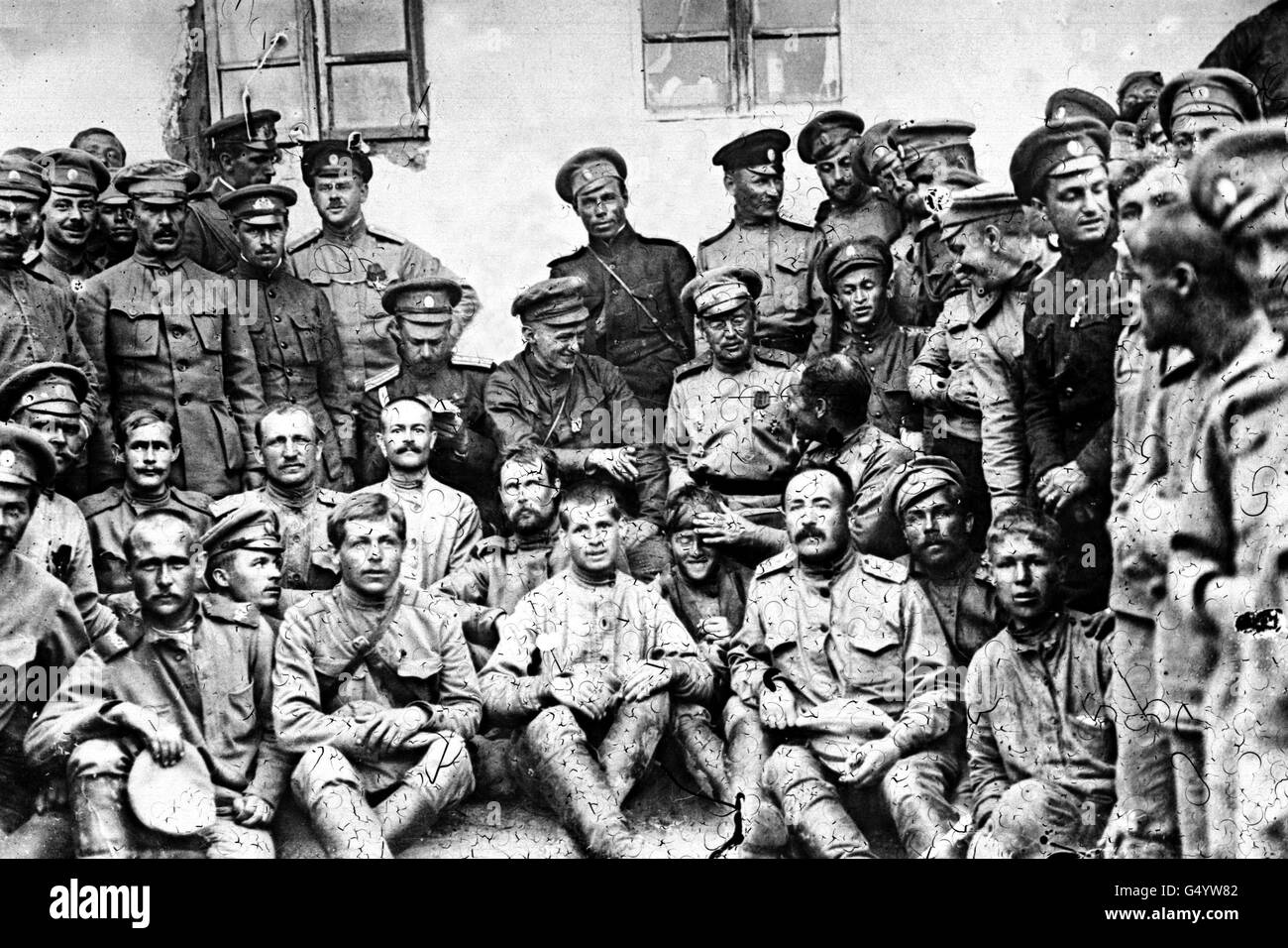 Aleksandr Kerensky (1881-1970): He is seen in the centre of the group with finger raised, joking with a Russian soldier. Kerensky was a Russian Liberal Revolutionary leader and Prime Minister of the Provisional Government from July - October 1917. * Pictured during a visit to the Russian Front to encourage the troops, during the First world War. He was overthrown during the Bolshevik October Revolution. Stock Photo