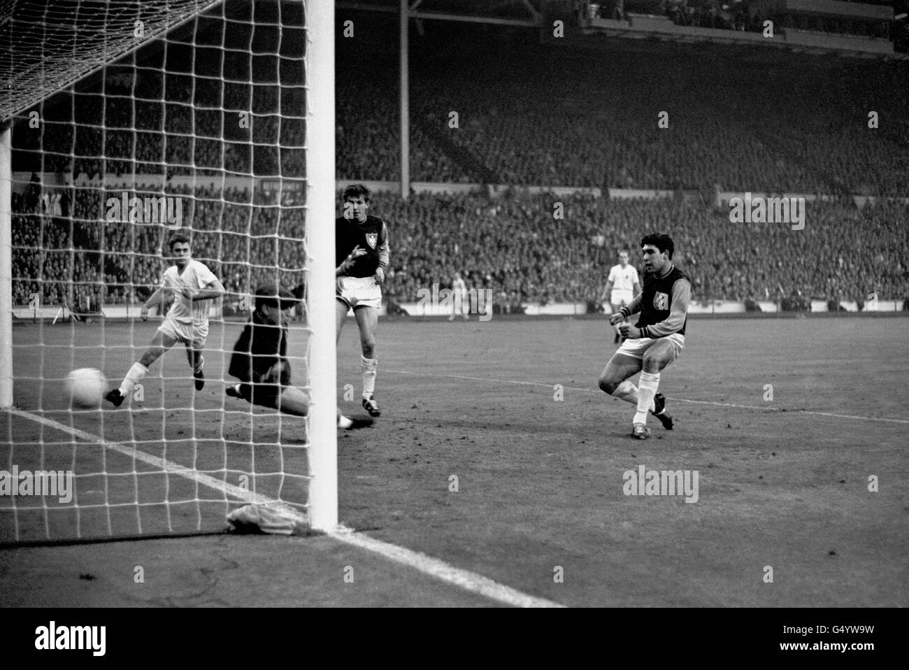 West Ham United's Sealey (R) puts the second goal, into the back of the net past the Munich goalkeeper Radenkovic, during the European Cup Winners Cup Final at Wembley, London. Stock Photo