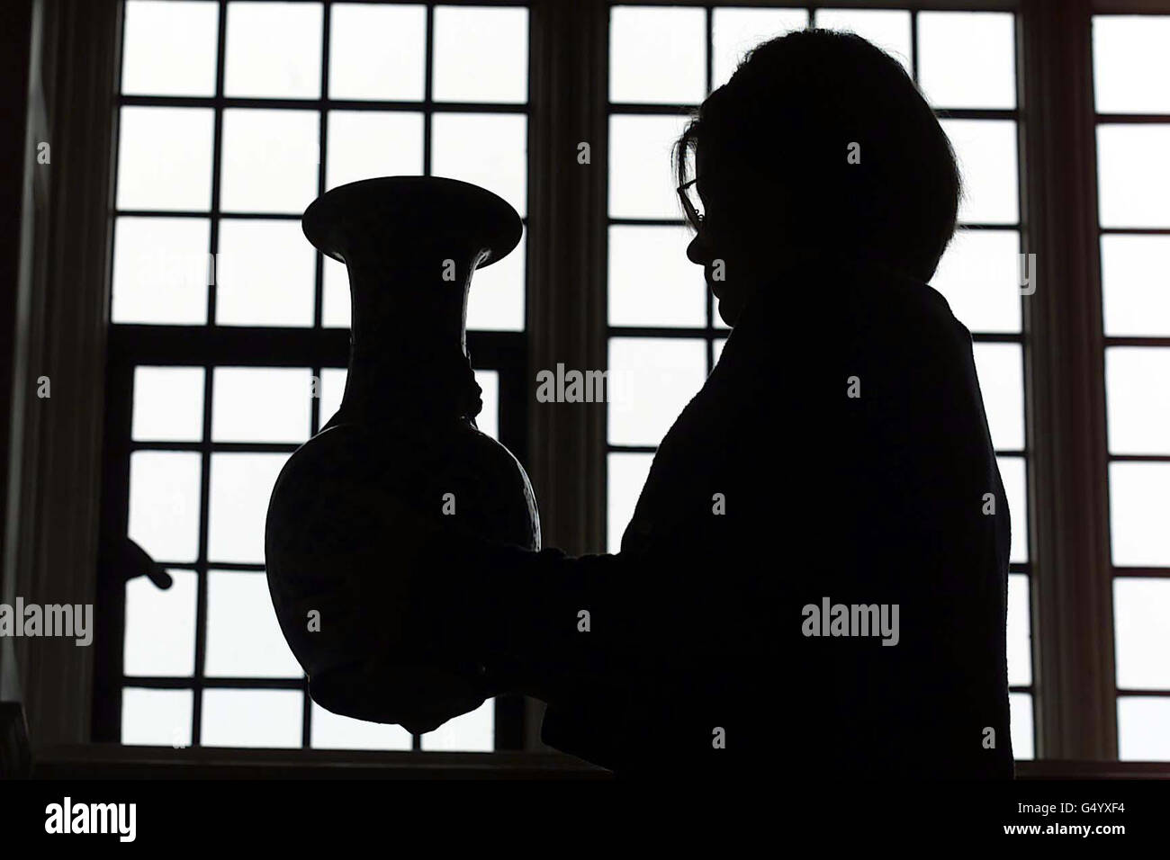 A National Trust Conservation cleaner puts the finishing touches to Standen in Sussex. All