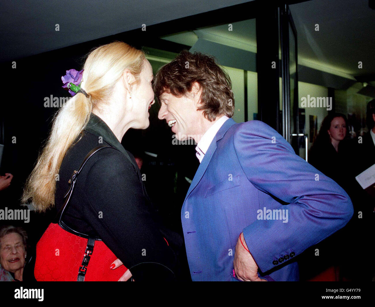 Veteran singer Mick Jagger, of rock group the Rolling Stones, alongside his ex-wife Jerry Hall at Dartford Grammar school, Kent, where he opened 'The Mick Jagger Centre' at the School, which he left in 1961. * The new state-of-the-art centre has been built with the help of a 2.2 million National Lottery grant. Stock Photo