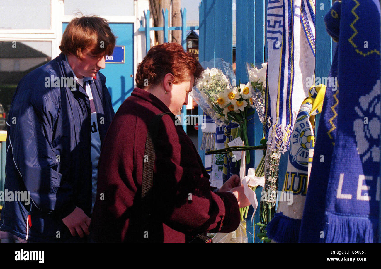 Leeds United fans lay floral tributes at the gates of Elland Road, the home of Leeds United Football Club, in memory of two Leeds Fans who were killed during an outbreak of fighting in Istanbul. Stock Photo