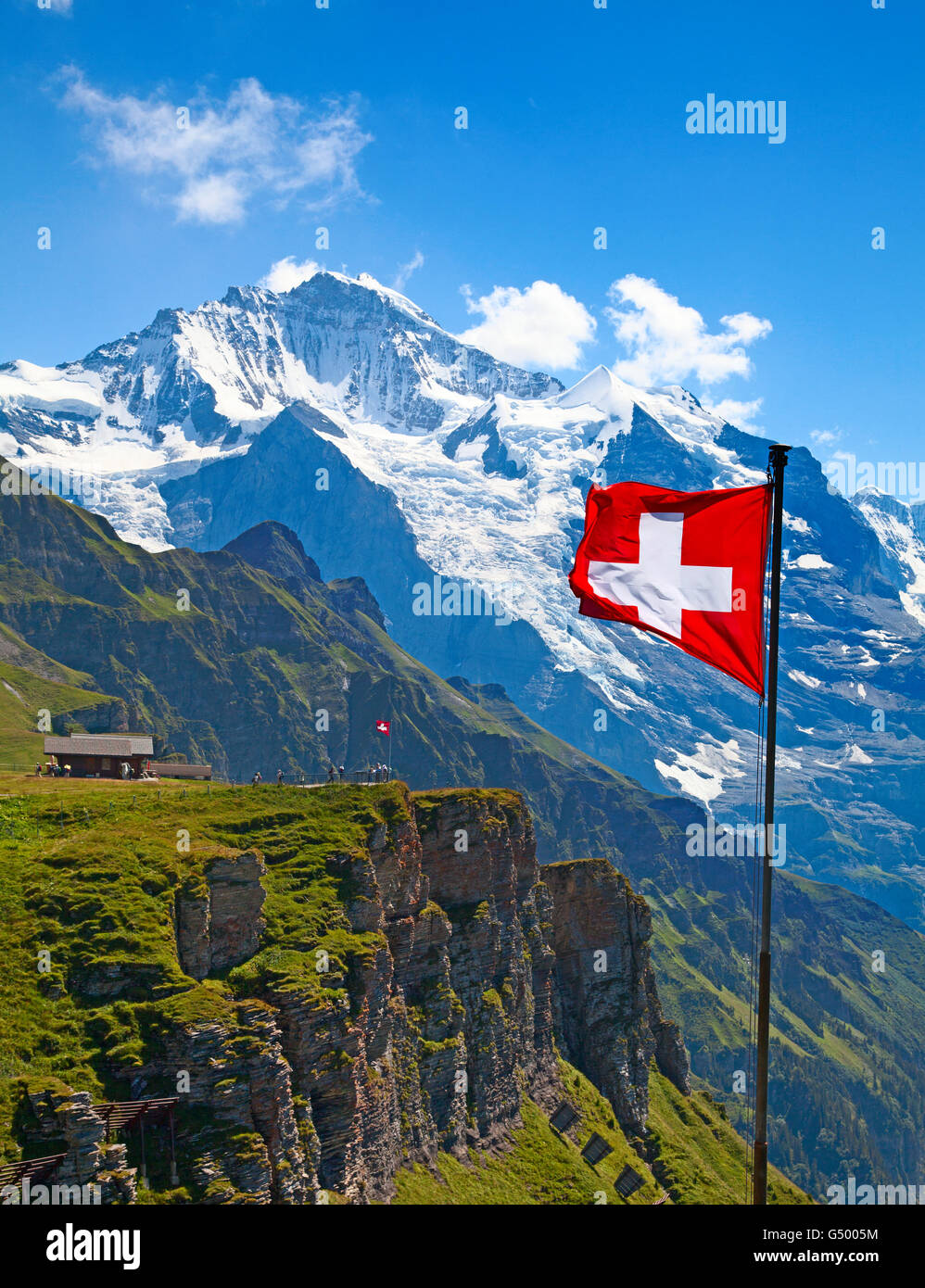 Swiss flag on the top of Mannlichen (Jungfrau region, Bern, Switzerland) Stock Photo