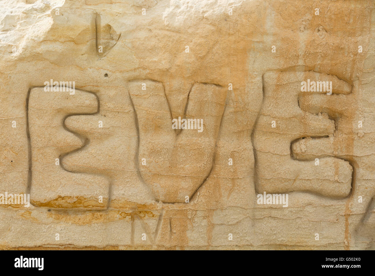 New Zealand, Northland, Baylys Beach, sandstone with Eve lettering ...