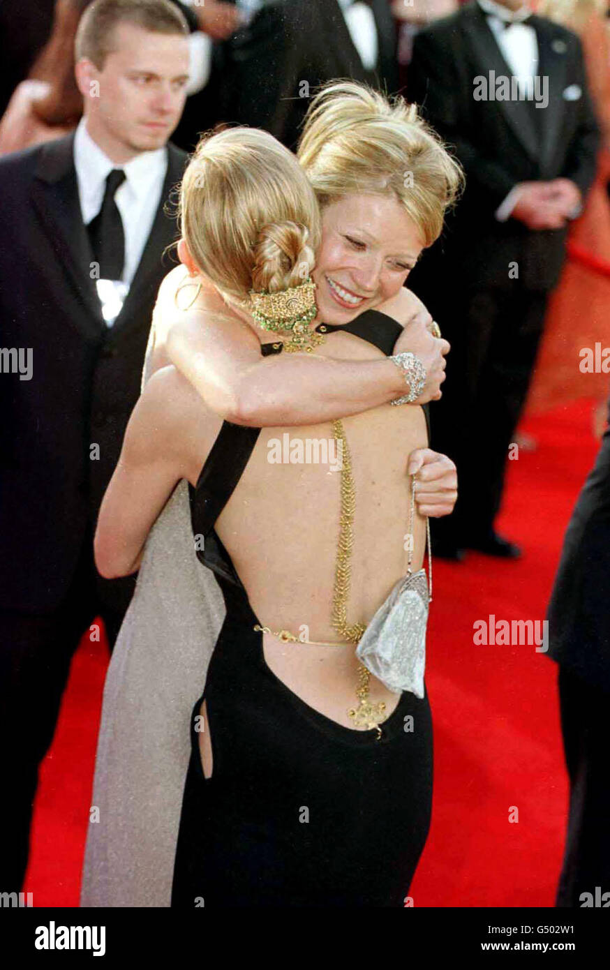 Actress Gwyneth Paltrow rear in a Calvin Klein dress hugs fellow actress Cate Blanchett who was wearing a black Jean Paul Gaultier dress as they arrived for the 72nd Annual Academy Awards
