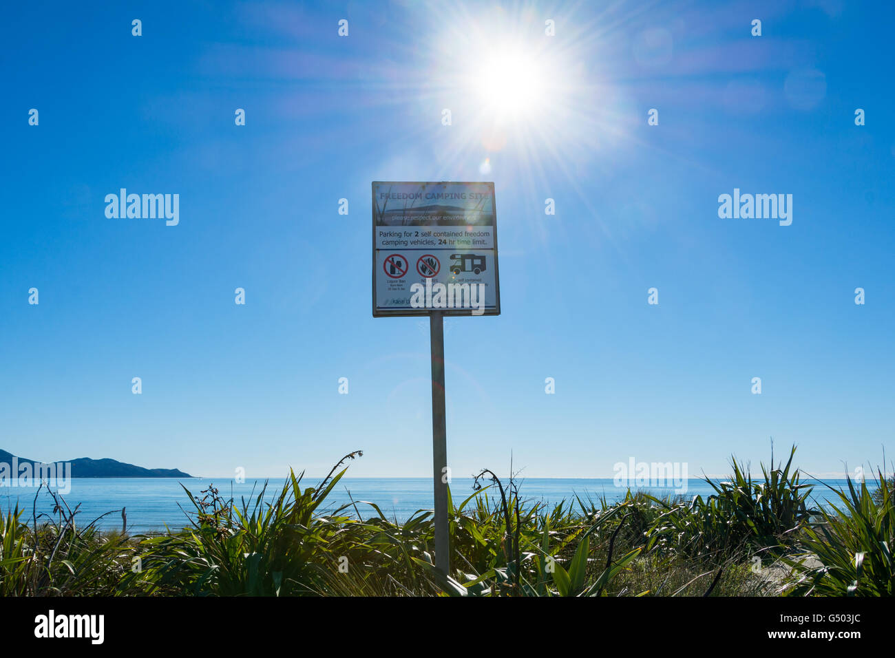 New Zealand, Wellington, Otaki Beach, prohibited sign on the coast of New Zealand in the back light Stock Photo