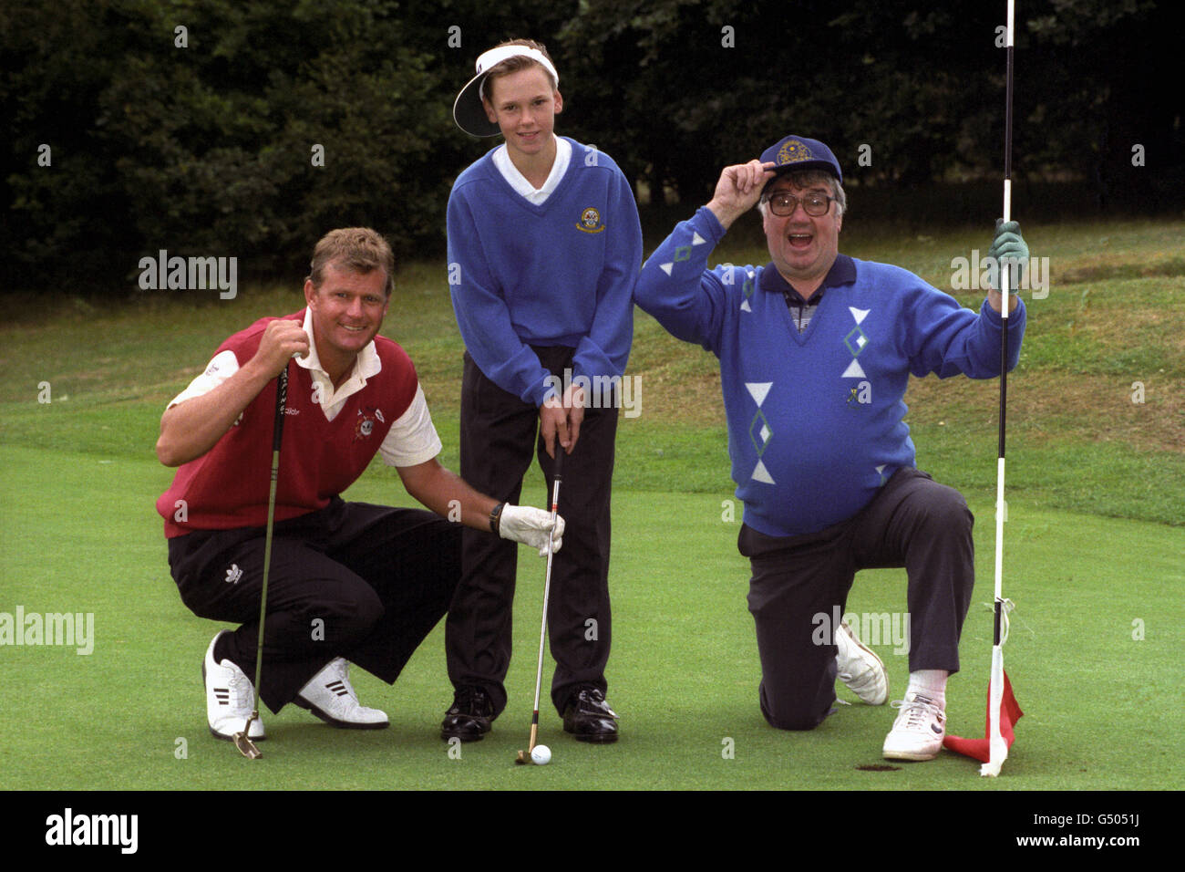 Former leukaemia sufferer, 14 year old David Evans (centre), from Gwynedd, North Wales, joined two of his heroes golfer Sandy Lyle and Northern Ireland comedian Frank Carson for Sandy's Stableford during Wentworth's Celebrity Pro-Am Golf Tournament. The Stableford is an annual fund raising event for children with leukaemia. Stock Photo