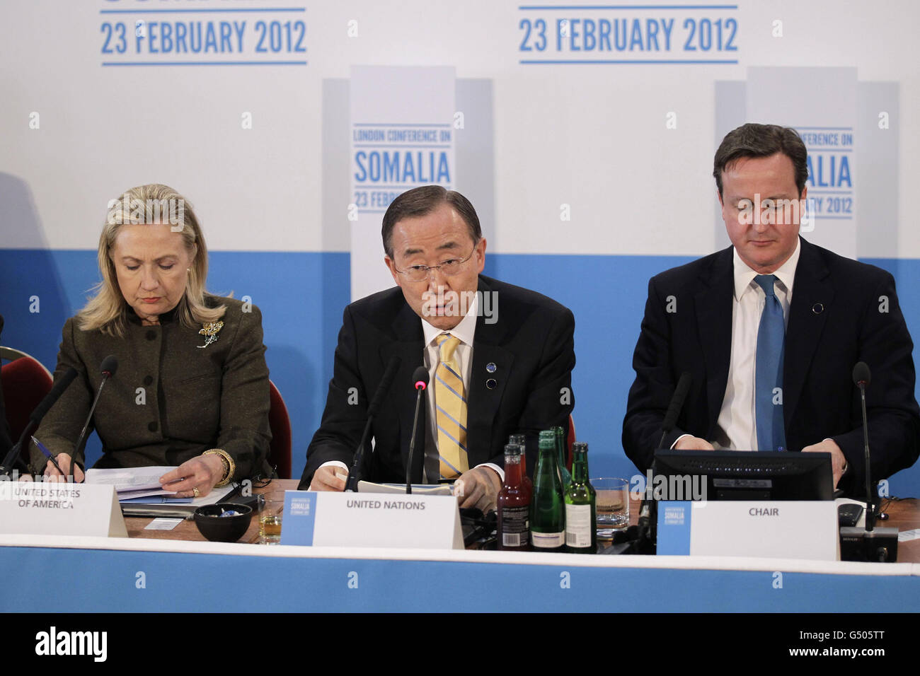 UN Secretary-Genaral Ban Ki-Moon, (centre), talks as Prime Minister David Cameron, and US Secretary of State Hilary Clinton listen on during the Somalia Conference at Lancaster House in London. Stock Photo