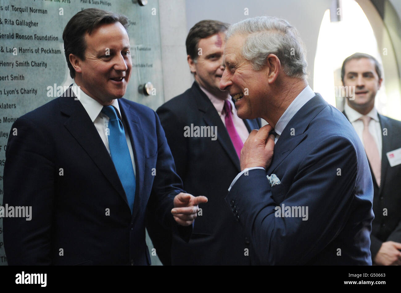 The Prince of Wales (right) talks with Prime Minister David Cameron (left), at the Communities Summit in Camden north London. Stock Photo
