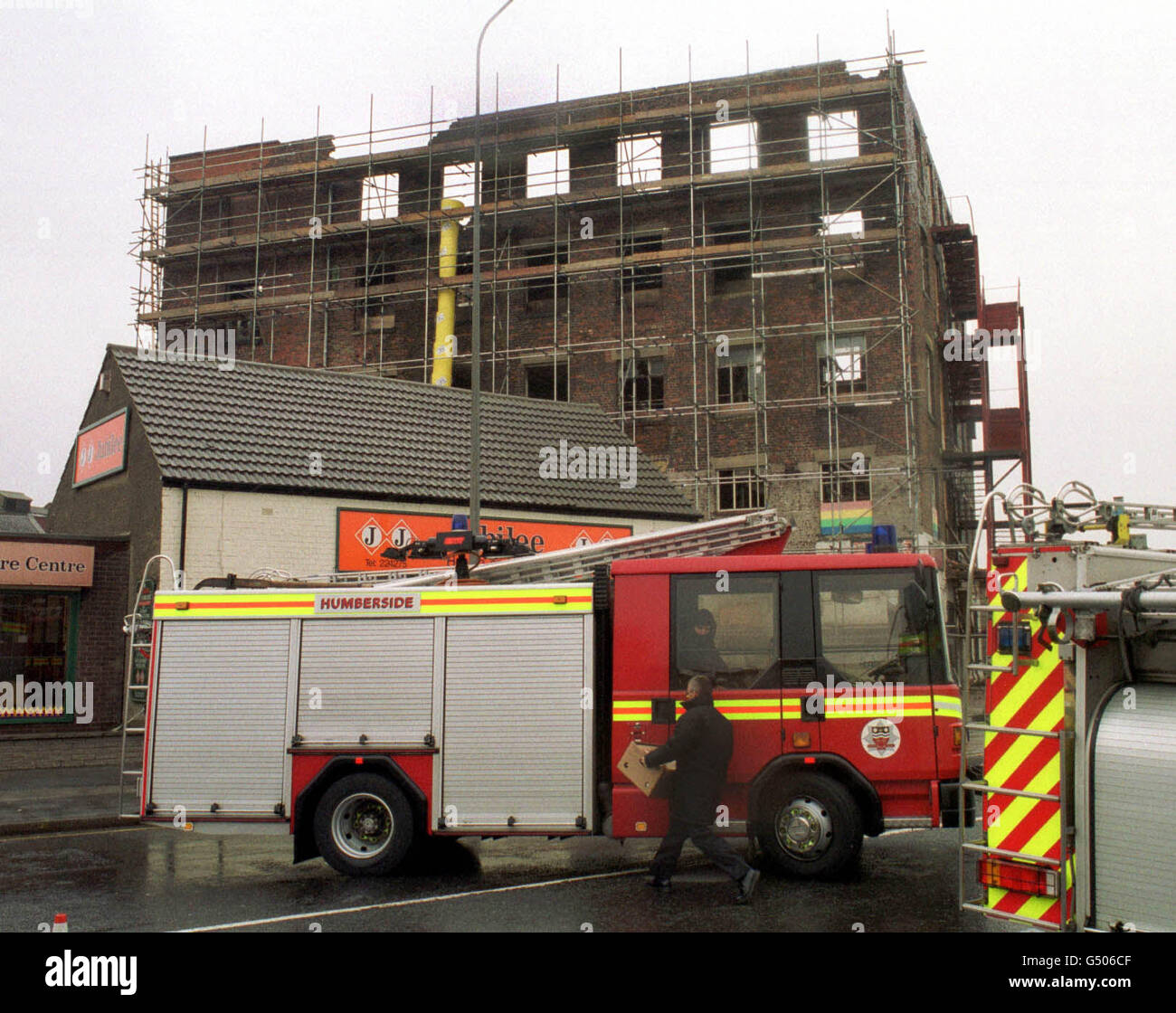 Fireman coordinate the rescue operation for the three workmen trapped in the ruins of a collapsed building on Cleveland Street in Hull. The men were working on the building for a demolition firm. Stock Photo
