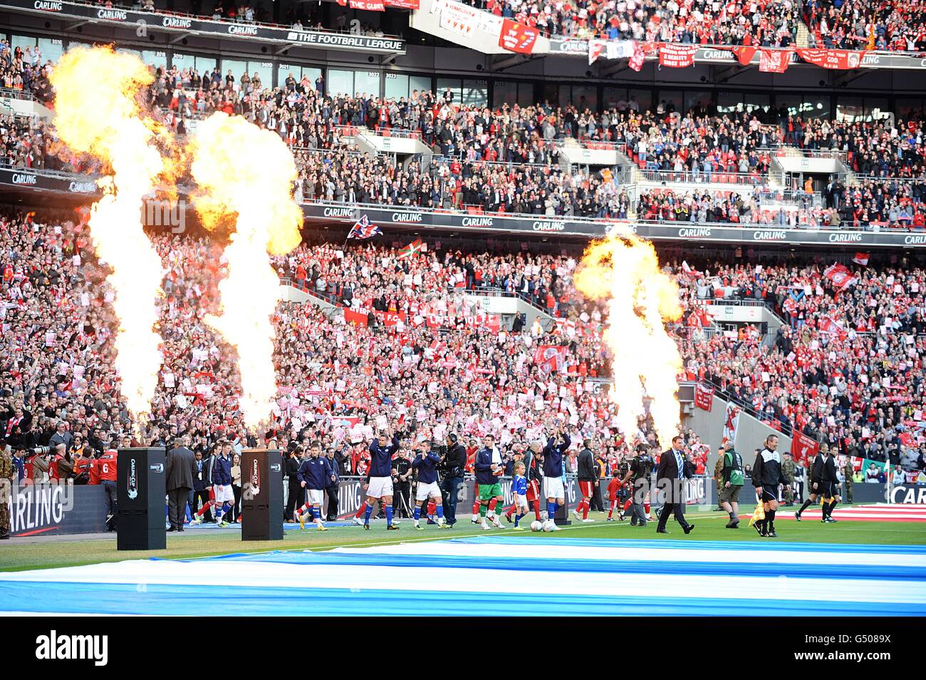 Soccer - Carling Cup - Final - Cardiff City v Liverpool - Wembley Stadium. The teams walk out between pyrotechnic displays before the game Stock Photo