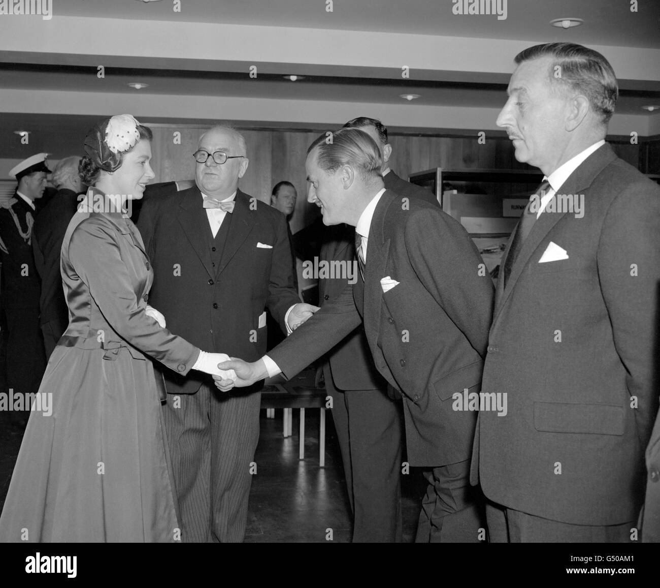 Mr W.G Turriff is presented to Queen Elizabeth II at Gatwick Airport, which the Queen was officially opening. Stock Photo