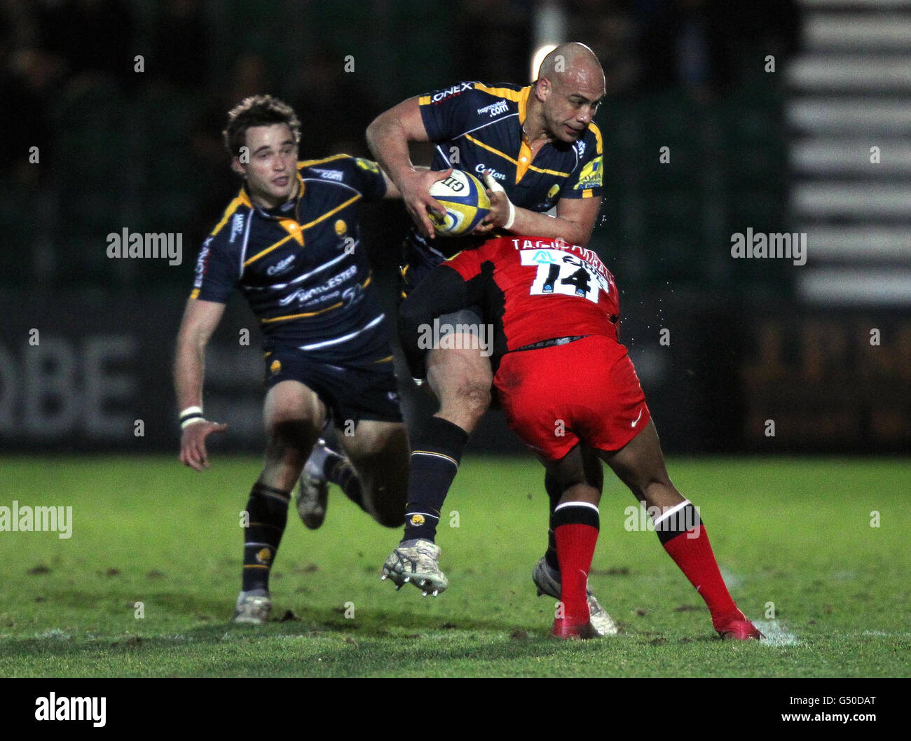 Worcester's Dale Rasmussen is tackled by Saracens Michael Tagicakiibau during the Aviva Premiership match at Sixways Stadium, Worcester. Stock Photo
